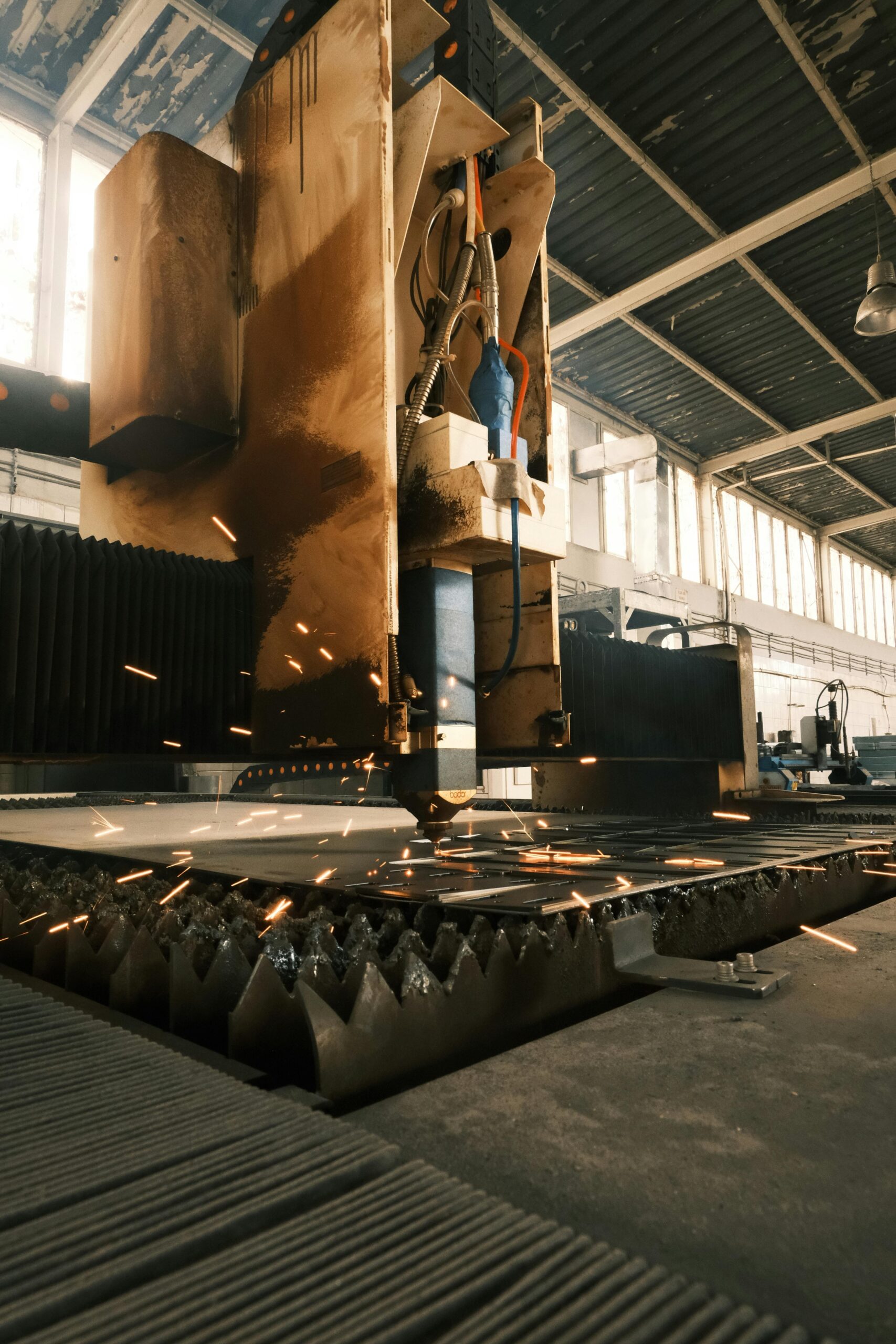 High-tech laser cutter operating in a modern industrial environment.